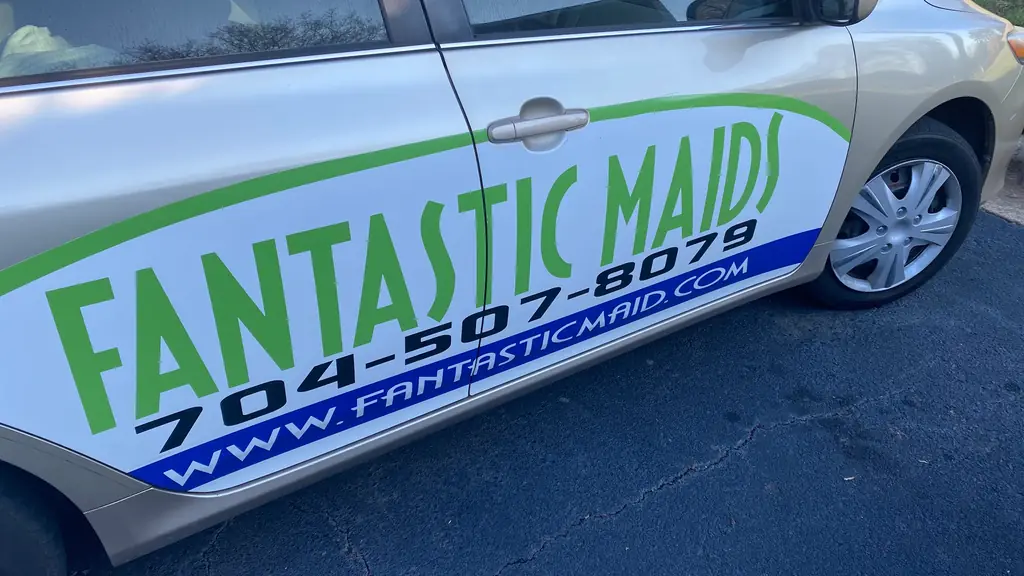The car door lettering with the phone number and website